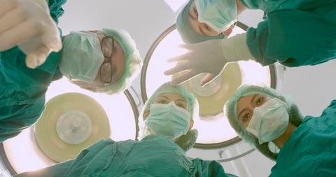 Doctors looking at the patient in operating theater. Stock Footage 90520511
