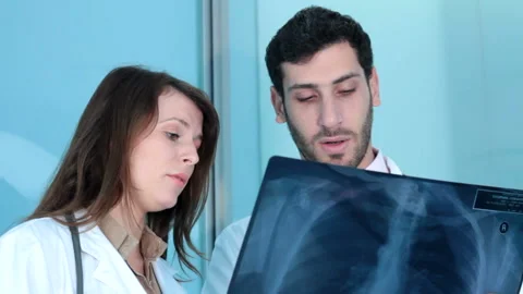 Doctors looking an xray close up Stock Footage 210669015