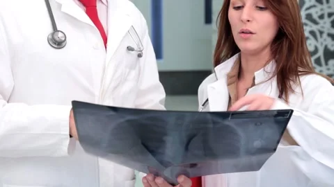  Doctors looking an xray close up Stock Footage 210670334