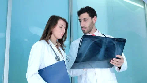 Doctors looking an xray  Stock Footage 210668619