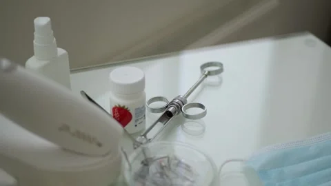 The doctor's metal tools lie on the table. Syringe for anesthesia. Stock Footage 255226539