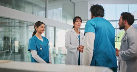 Doctors, nurses and greeting with handshake in clinic for onboarding, new Stock Footage 320282184