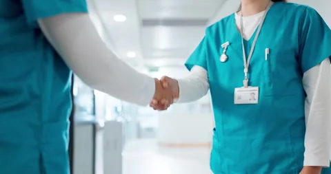 Doctors, nurses and shaking hands for hospital welcome, introduction and Stock Footage 254839675