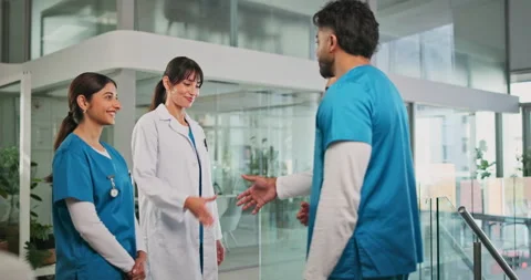 Doctors, nurses and welcome with handshake in clinic for onboarding, internship Stock Footage 320151722