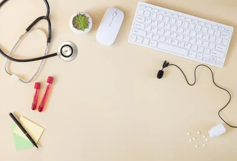 Doctor`s online consultation concept with computer and microphone Stock Photos