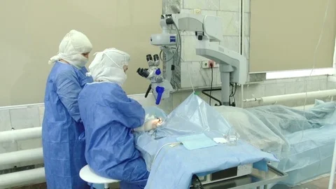 Doctors operate on a patient Stock Footage 103188602