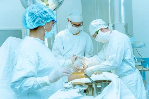 Doctors operate on a patient Stock Photos