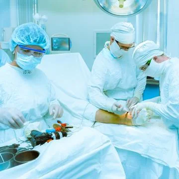 Doctors operate on a patient Stock Photos