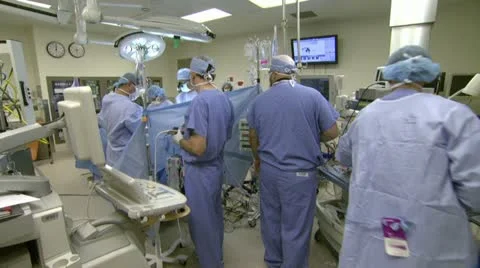 Doctors in Operating Room Preparing for Surgery Video stock 20956337