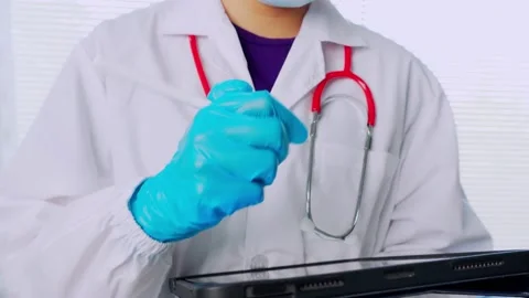 Doctors or scientists are carrying syringes with liquid vaccines for young and o Stock Footage 146170772