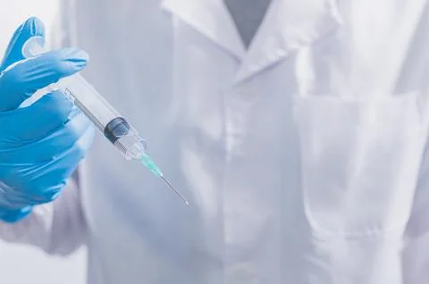 Doctors or scientists are using vaccines to fight COVID-19 or believe other.. Stock Photos