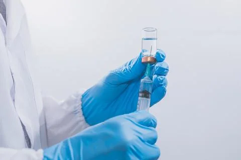 Doctors or scientists are using vaccines to fight COVID-19 or believe other.. Stock Photos