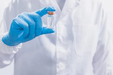 Doctors or scientists are using vaccines to fight COVID-19 or believe other.. Stock Photos