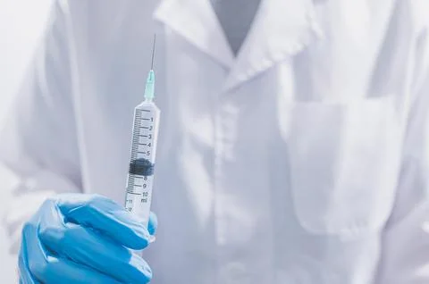 Doctors or scientists are using vaccines to fight COVID-19 or believe other.. Stock Photos