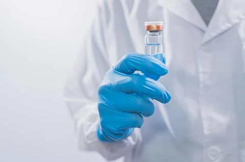Doctors or scientists are using vaccines to fight COVID-19 or believe other.. Stock Photos
