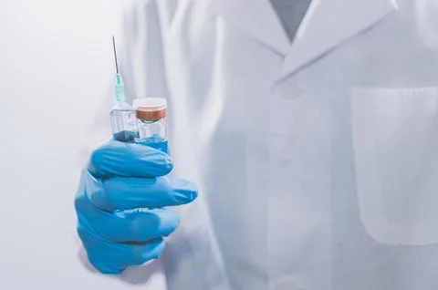 Doctors or scientists are using vaccines to fight COVID-19 or believe other.. Stock Photos