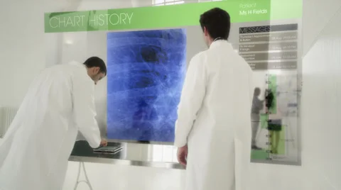 Doctors or scientists using Interactive computer whiteboard.   Видео 32943192