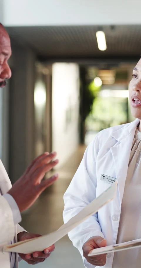 Doctors, paperwork and argument with file in hospital for medical opinion, Stock Footage 329442082