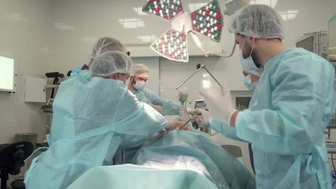 Doctors perform surgery Stock-Footage 73556046