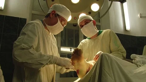 Doctors perform surgery on his legs Stock Footage 130793774