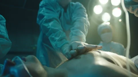 Doctors performing CPR at the hospital Stock Footage 283146678