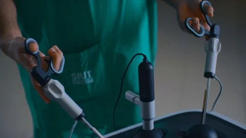 Doctors performing surgery Stock Footage 105820080