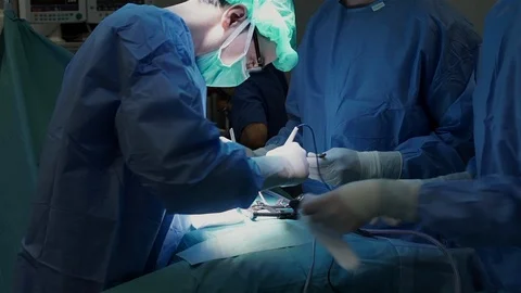 Doctors Performing Surgery in Operating Room. Stock Footage 92158466