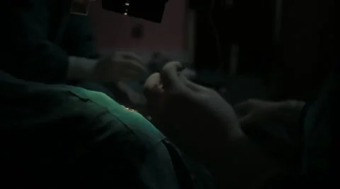 Doctors performing surgery in operating theatre Stock Footage 62924099