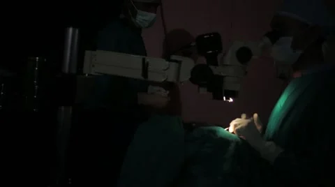 Doctors performing surgery in operating theatre Stock Footage 62924113