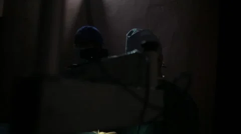 Doctors performing surgery in operating theatre Stock Footage 62924115