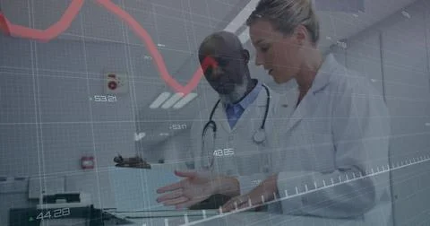 Doctors pointing at blue folder, initiating animated red trend line while Stockfoto's