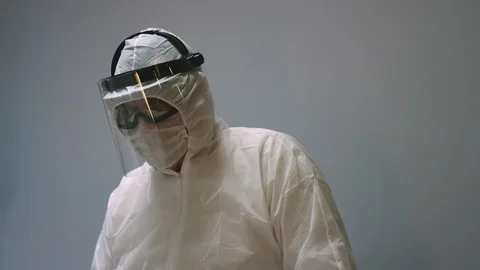 Doctors in Protective Suits Consult Coronavirus Patient's Status Stock-Footage 126205353