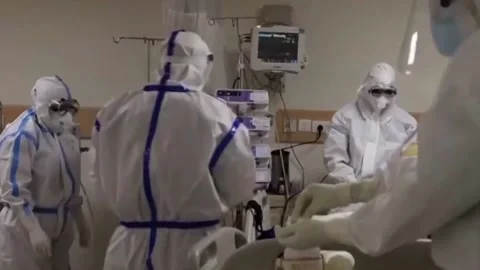 Doctors in protective suits in a ward with patients on covid (3) Stock Footage 152731922
