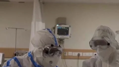 Doctors in protective suits in a ward with patients on covid (2) Stock Footage 152731929