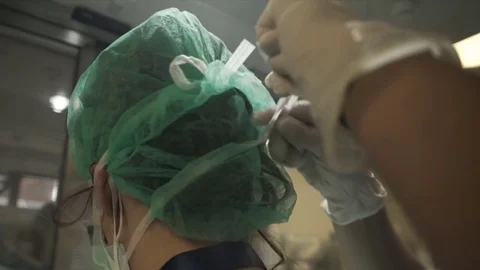  Doctors in protective suits in wards with patients. Coronavirus Stock Footage 128980288