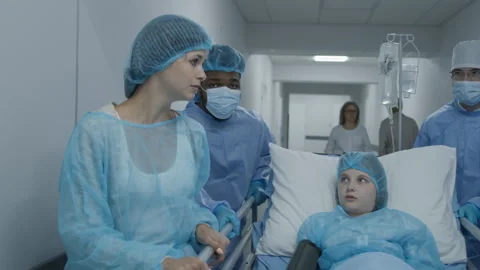 Doctors push stretcher with sick young girl Stock Footage 250292562