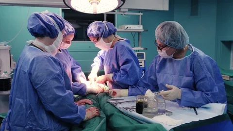 Doctors remove the tumor Stock Footage 128747977