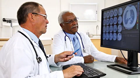 Doctors Reviewing Test Result Stock Footage 43357455