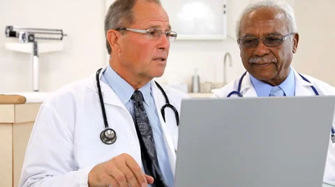 Doctors Reviewing Test Result Stock Footage 43357663