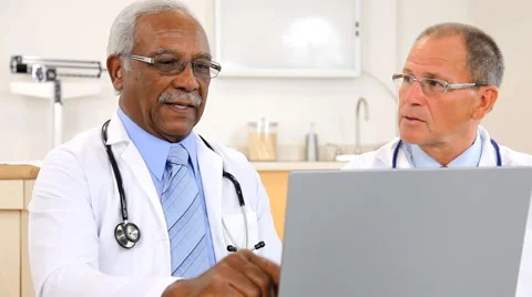 Doctors Reviewing Test Result Stock Footage 43357832