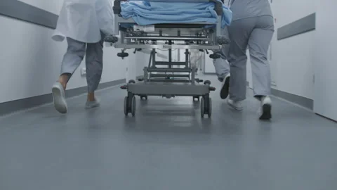 Doctors run and push stretcher to operation room Stock Footage 250293158