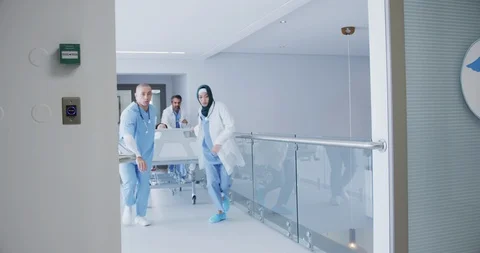 Doctors running with patient in hospital bed in emergency 4k Stock Footage