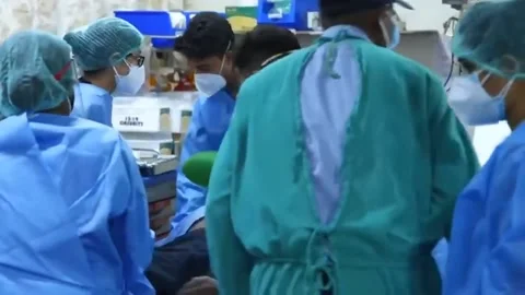 Doctors save a man who has fallen into a coma. Pandemic Covid Stock Footage 155362160