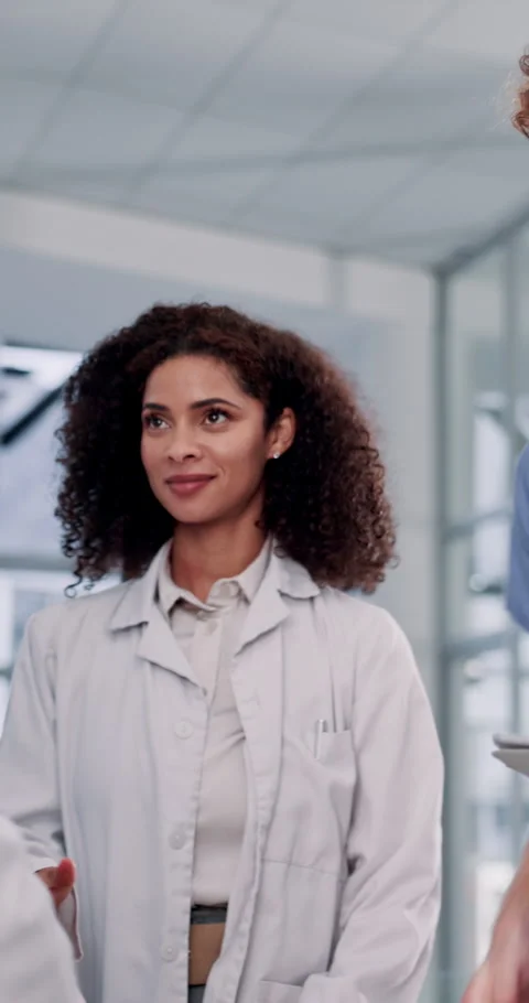 Doctors, shaking hands and happy at hospital, group or internship for career Stock Footage 295433662