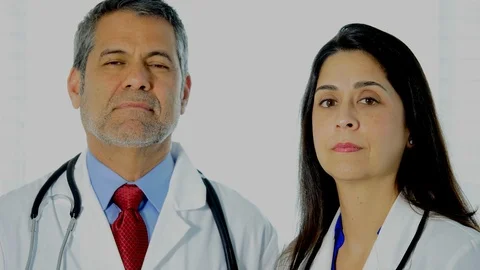 Doctors show tablet with 5 things to avoid spreading the Covid-19 coronavirus Stock Footage 127127484