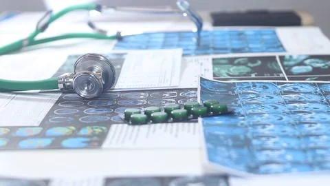 Doctors study with a chart and prescribe a prescription for tablets Stock Footage 86690424