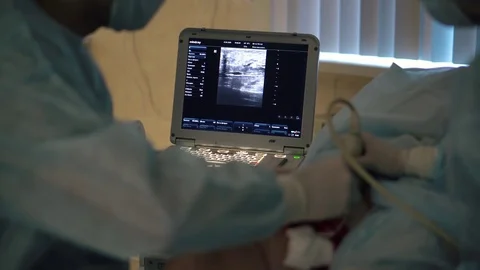 Doctors surgeons do surgery on the leg with special equipment in the operating Stock Footage 126746650