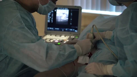 Doctors surgeons do surgery on the leg with special equipment in the operating Stock Footage 126746713