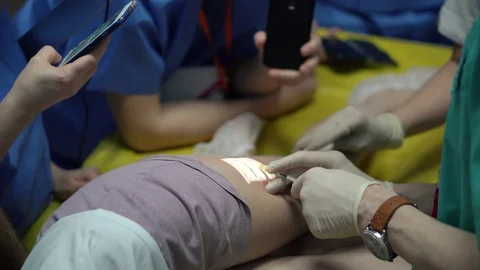 Doctors surgeons do surgery on the leg with special equipment in the operating Stock Footage 126746822