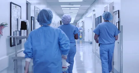 Doctors surgeons nurses walking down hospital corridors collection Stock Footage 145910706